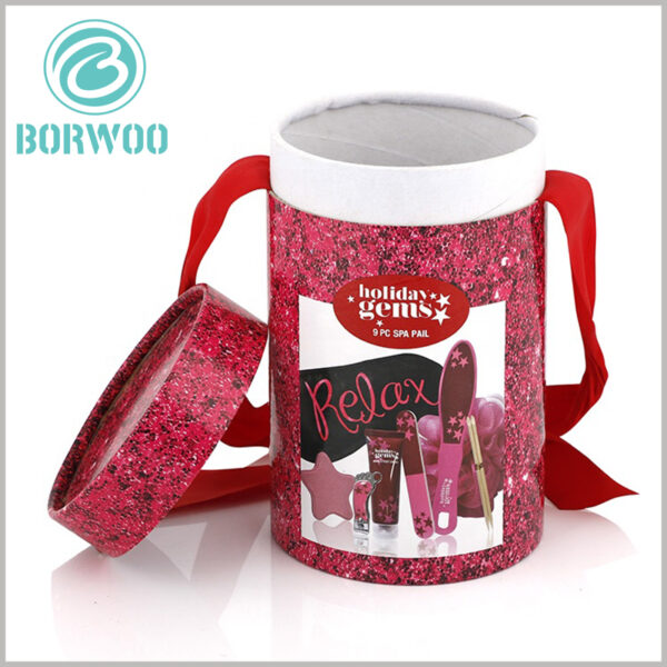 Custom cardboard tube gift packaging for cosmetic set.The ribbon is clipped between the inner and outer tube to be held firm and to give it a good decoration